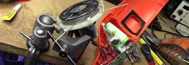Vacuum cleaner repair parts and tools on a workbench in Madison, WI
